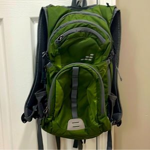 A unisex hiking backpack with pocket to hold water pouch and straw. It is used